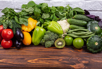 Vegetarian diet food concept. Fresh vegetables knolling composition. Flat lay with various vegetables on wooden table. Fresh vegetables arranged symmetrically on board. Healthy vegan food. Ingredients