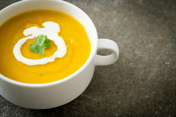 pumpkin soup in white bowl