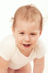 beautiful caucasian baby with big smile looking at the camera