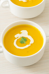 pumpkin soup in white bowl