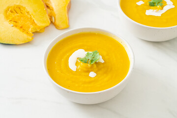 pumpkin soup in white bowl