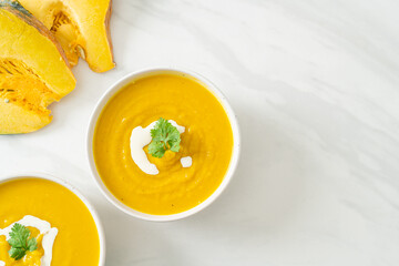 pumpkin soup in white bowl