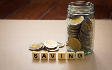 Saving money concept. Money in glass jar.