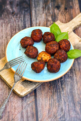 Home made deep fried   mini  fish and vegetables meatballs ,on  rustic background