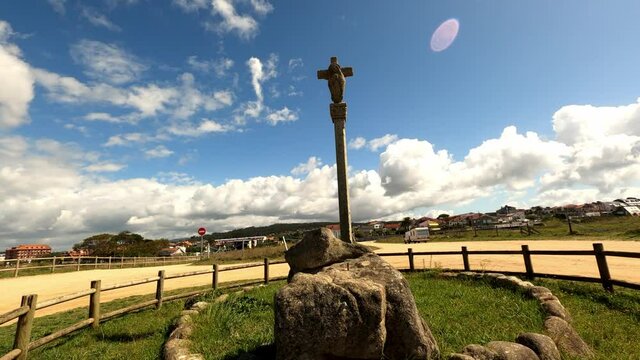 Traveling backwards from crucifix ( stone cross ) in the hermitage area of La Lanzada beach in Galicia, Spain.