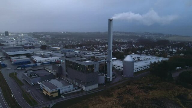 Smoke Coming Out On Chimney Of Statkraft Incineration Plant On A Gloomy Day In Tiller, Norway. - aerial