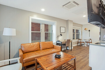 Small studio apartment in city with hardwood floors and open floor plan