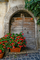 Fototapeta na wymiar The wooden door of an old house in Carpinone, a medieval village in the Molise region, Italy.