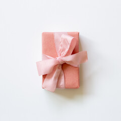 Pink gift box isolated on white background. top view, copy space