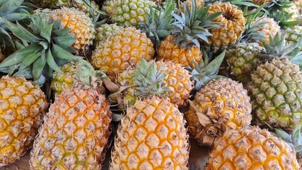 pile of pineapples at the fruit market