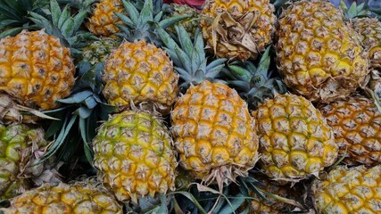 pile of pineapples at the fruit market
