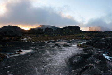 Fototapeta na wymiar landscape of dark stones at dawn