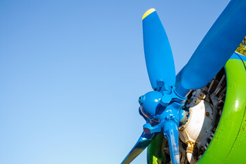 the propeller of the aircraft close-up. propeller blades. The engine of the old flying machine. Blue sky