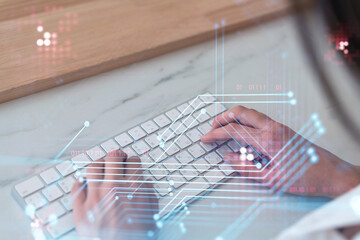 Woman typing the keyboard to create innovative software to change the world and provide a...
