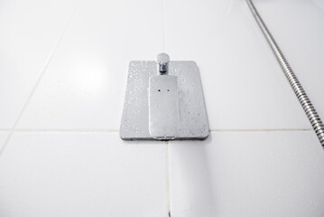Shower tap in chrome bathroom.