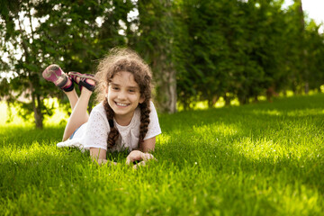 Fototapeta premium Happy adorable little girl having fun at the park