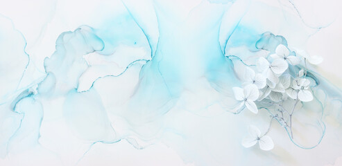 Creative image of pastel blue Hydrangea flowers on artistic ink background. Top view with copy space