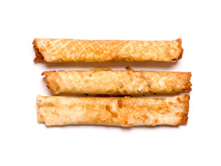 Dessert baked rolls with sweet filling. Confectionery on a white background. Studio photography