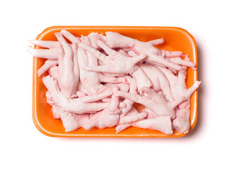 Chicken feet in the package. Meat semi-finished products. View from above