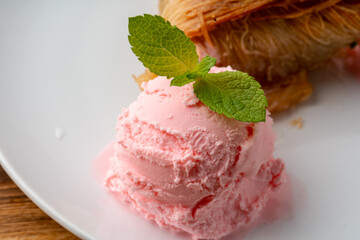 Close up photo of Turkish baklava served with ice cream