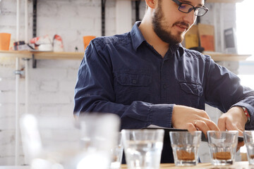 Man writing coffee examine results