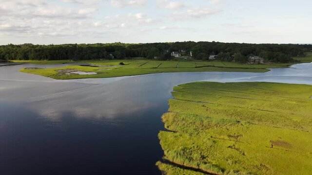 Aerial View Of Salt Marsh With Green Vegetation Near Scituate Town in Massachusetts. - pullback