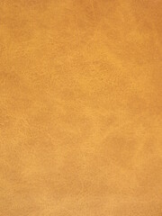 Suede surface in beige and mustard color as a background. High quality photo