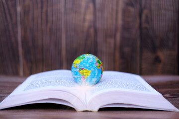 World map on a book. Education and school concept