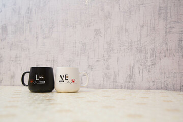 Love mug cup white backgrounds . White and black colored cup I love you . Mr. Handsome Mrs. Beautiful couple mug . Picture of heart and pulse . Azerbaijan Baku . 25.04.2021 .