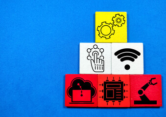 Colored cubes with technology items and the Industry 4.0 infographic on a blue background.