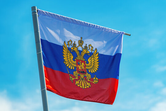 Russian flag with the coat of arms, two-headed eagle without the shield