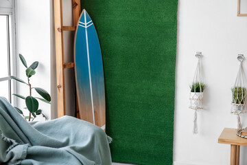 Interior of stylish room with surfboard