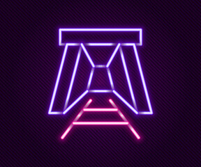 Glowing neon line Mine entrance icon isolated on black background. Colorful outline concept. Vector