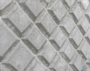 Fototapeta premium Decorative wall made of concrete, figures on a concrete wall