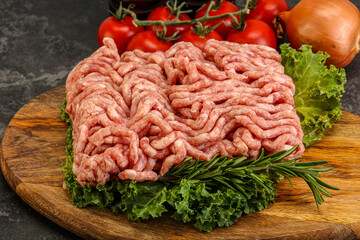 Raw pork minced meat over board