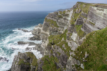 cliffs of kerry on the wild Atlantic way with blue sky and white water waves