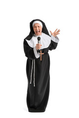 Mature nun with microphone singing on white background