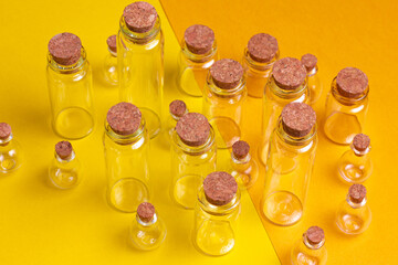 Glass jars with wooden stoppers. A set of multi-caliber glass beads on a double background.