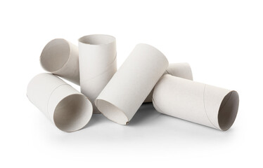 Heap of empty cardboard toilet roll tubes on white background