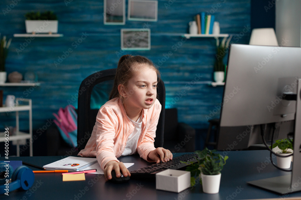 Poster tired overwork little child browsing school information on computer while working at literature home