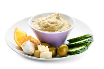 Bowl with tasty baba ghanoush and plate with lemon and vegetables on white background