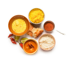 Traditional Indian food and spices on white background
