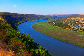 Idyllic scenery with river . Village situated on the riverside . River Dnister in Moldova 