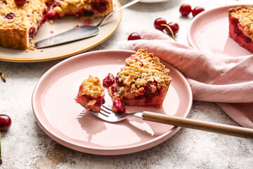 Plate with piece of tasty cherry pie on light background, closeup