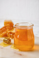 Jar with honey on table