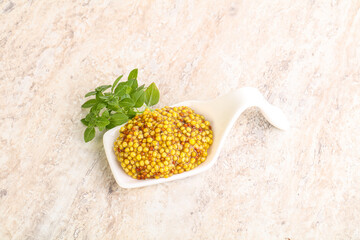 Grain mustard sauce in the bowl