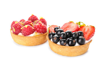 Tasty berry tartlets on white background