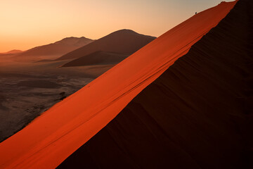 Fototapeta na wymiar Sunrise on the beautiful dunes of the Namib Desert, Sossusflei, Namibia, South Africa