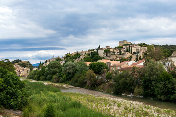 Fototapeta na wymiar Roman village Vaison-la-Romaine in two sides of the Ouveze river, Provence, France