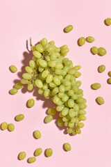 Fresh green grapes on color background